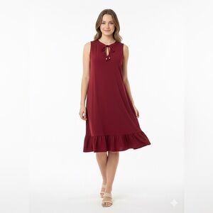 Michael Kors tie-neck sleeveless shift dress with a ruffled hem.